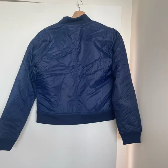 New Balance Blue Bomber Jacket with Quilted Fabric and Stand-Up Collar